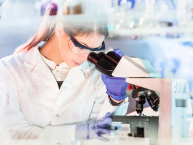 PIAS2 | Parkinson's News Today | Dementia research | Technician looking through microscope in laboratory