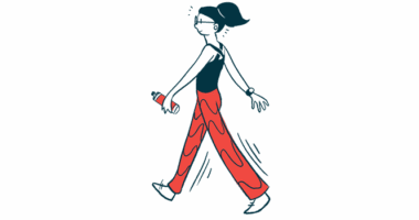 A woman wearing workout clothes walks holding small weights in each hand.