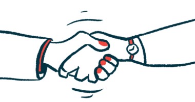 A close-up image of a handshake between two people, one wearing a watch.