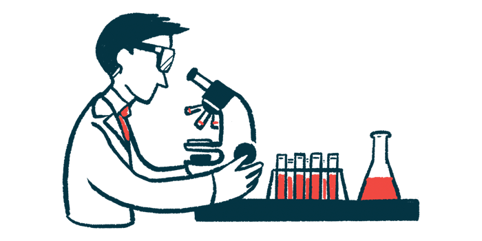 A scientist, with various samples nearby, examines one using a microscope.