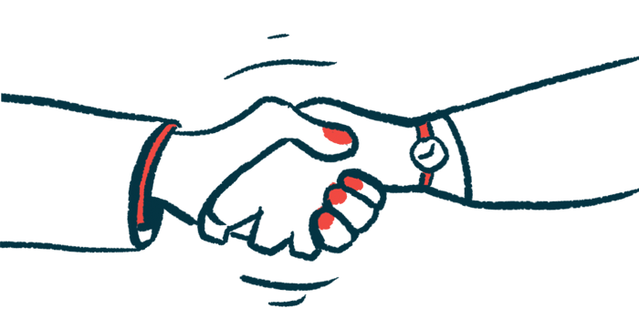 Two people shake hands in a partnership.