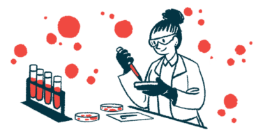 A scientist works with petri dishes in a lab alongside a rack of filled vials.