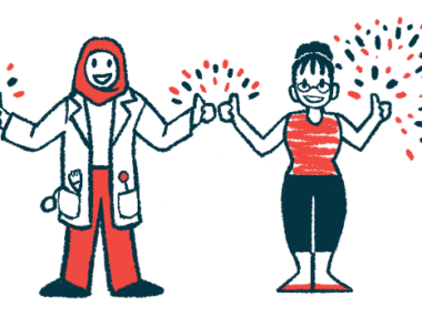 A doctor and patient stand together flashing a thumbs-up sign.