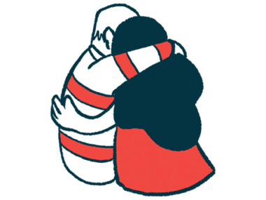 Two people in a close embrace are pictured from behind.