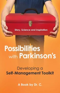 A book cover has an orange background with the title "Possibilities with Parkinson's" in white and the subtitle "Developing a Self-Management Toolkit" in black below it. At the bottom, in white, is "A Book by Dr. C." The image is of a torso, legs, and arms holding a red toolbox featuring the words "Story, Science and Inspiration."