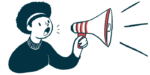 A person uses a bullhorn to make an announcement.