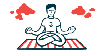 A person meditates while sitting on a mat with legs crossed and arms outstretched.