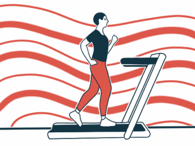 A person is seen walking on a treadmill.