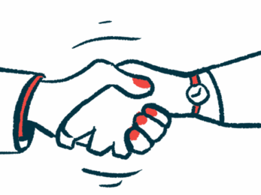 Two people are shown from the forearm down shaking hands.