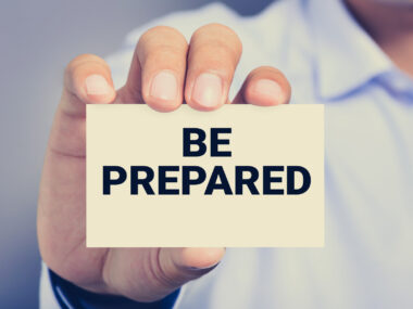 A man holding a card that says 