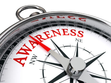 Awareness written on a compass pointing north
