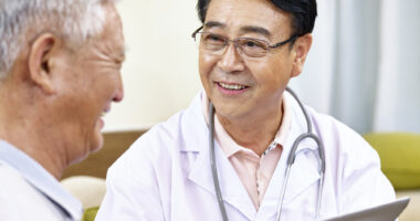 An older man talking to his doctor