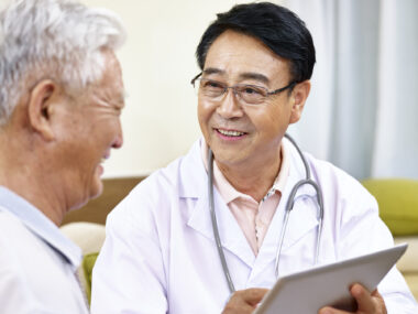 An older man talking to his doctor