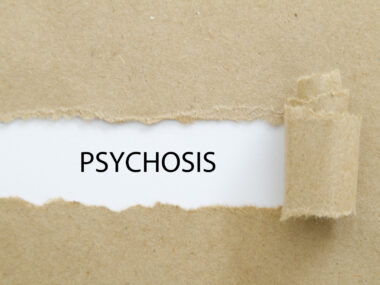 Brown paper torn in the middle with the word 