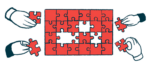 A jigsaw puzzle is shown that is being worked on by many people, illustrating a collaborative effort.