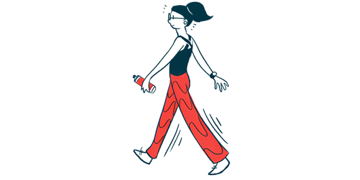 A woman walks while holding a water bottle.