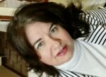 A close-up selfie-type profile photo that's rotated at an angle to add dynamic to it.