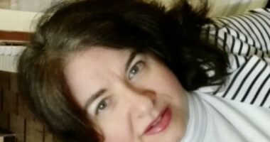 A close-up selfie-type profile photo that's rotated at an angle to add dynamic to it.