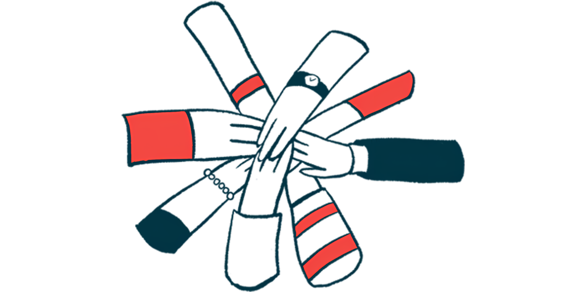 Many hands are seen coming together in a circle.