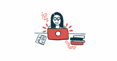 A woman types on a laptop.
