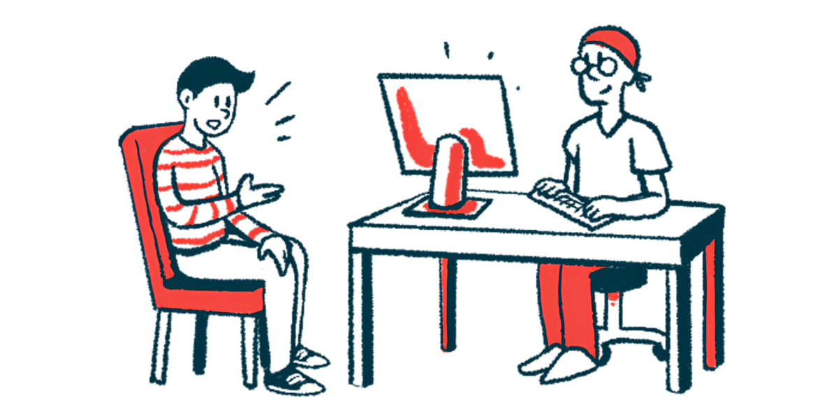 A seated person talks with another individual who is in a desk using a computer.